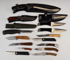 Fifteen various hunting and pocket knives including a set of three Hibben Knives throwing knives,