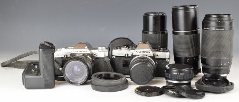 Olympus OM10 and OM30 35mm SLR cameras with 50mm 1:1.8, 35mm 1:2.8, 80-200mm 1:4.5 and 300mm 1:5.5