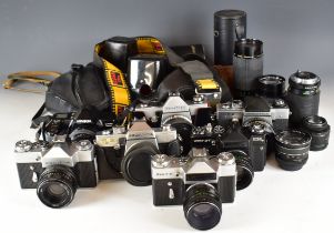 Seven 35mm SLR cameras comprising Praktica VLC2 with 35mm 1:2.8 lens, Praktica TL3 with Takumar 1: