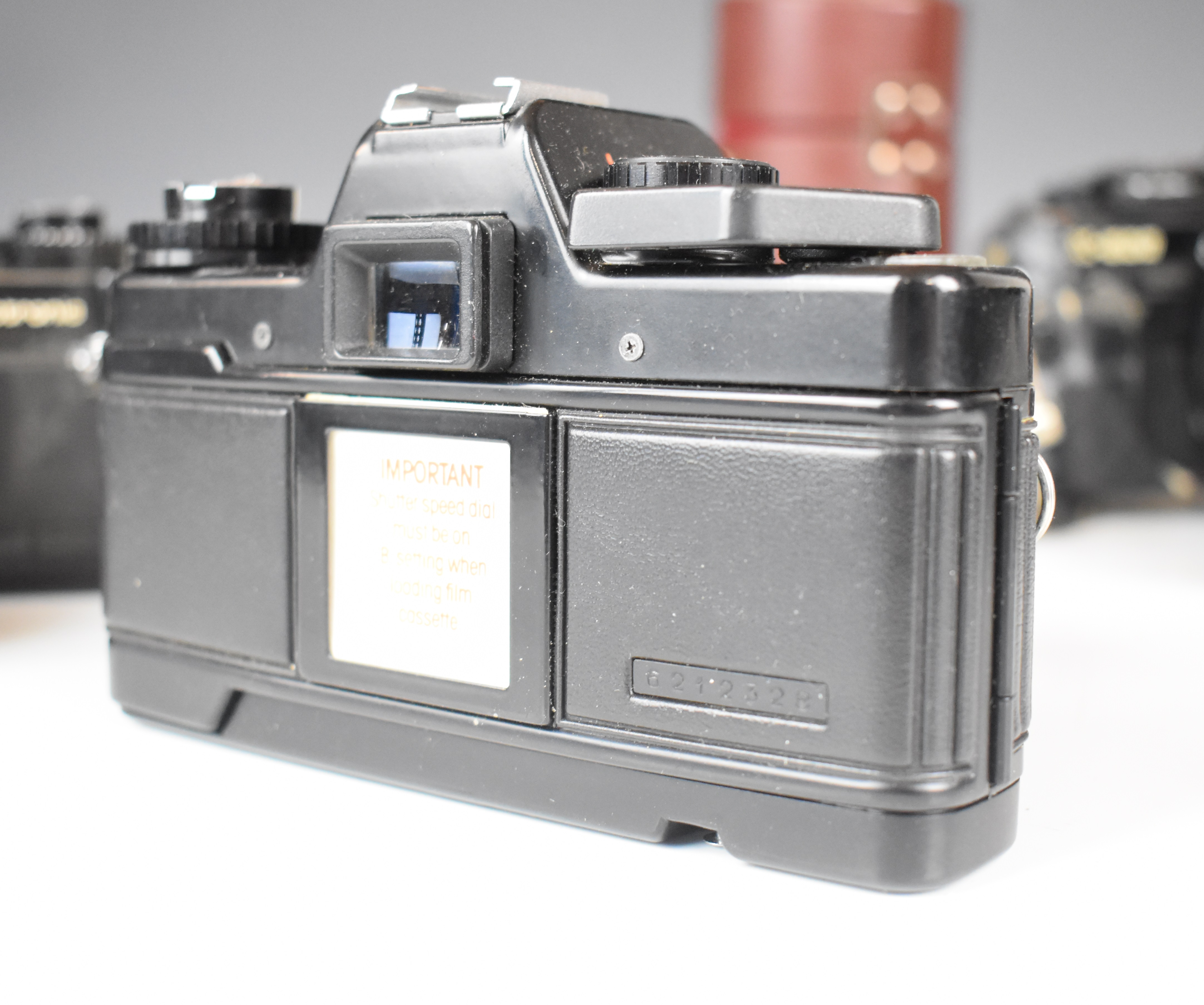 Three 35mm SLR cameras comprising Minolta X-500 with Minolta MD 50mm 1:1.7 and Super Paragon 28- - Image 9 of 11
