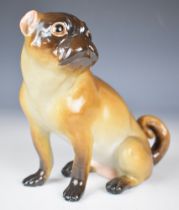 Meissen 19thC figure of a pug facing left, with faint blue crossed swords and impressed '73' to