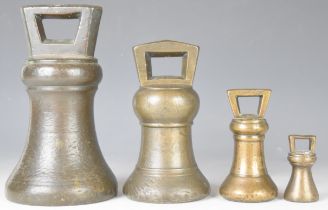 Four likely Georgian bronze bell weights from 14lb down to 2oz, the largest and smallest both marked