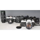 Four 35mm SLR cameras comprising Minolta XE-1 with Rokkor 1:1.2 f=58mm lens, Yashica FX-3 with