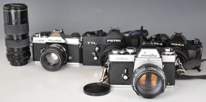 Four 35mm SLR cameras comprising Minolta XE-1 with Rokkor 1:1.2 f=58mm lens, Yashica FX-3 with