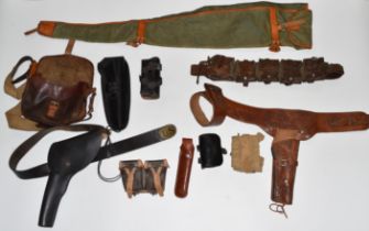 A collection of mainly leather shooting and gun accessories including shotgun or rifle slips,