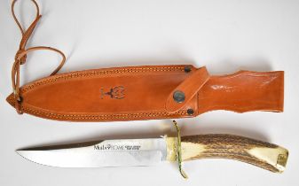 Muela Bowie knife with 22cm blade, brass cross guard, pommel stag horn grip and leather sheath.