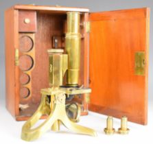 Cased 19th or early 20th century Swift & Son, University St. London WC brass microscope, with