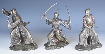 A set of three bronze style Japanese Samurai warrior figures, each 22cm tall.