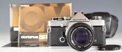 Olympus OM-1n 35mm SLR camera with Zukio 1:1.8 f=50mm lens, together with manuals and original box