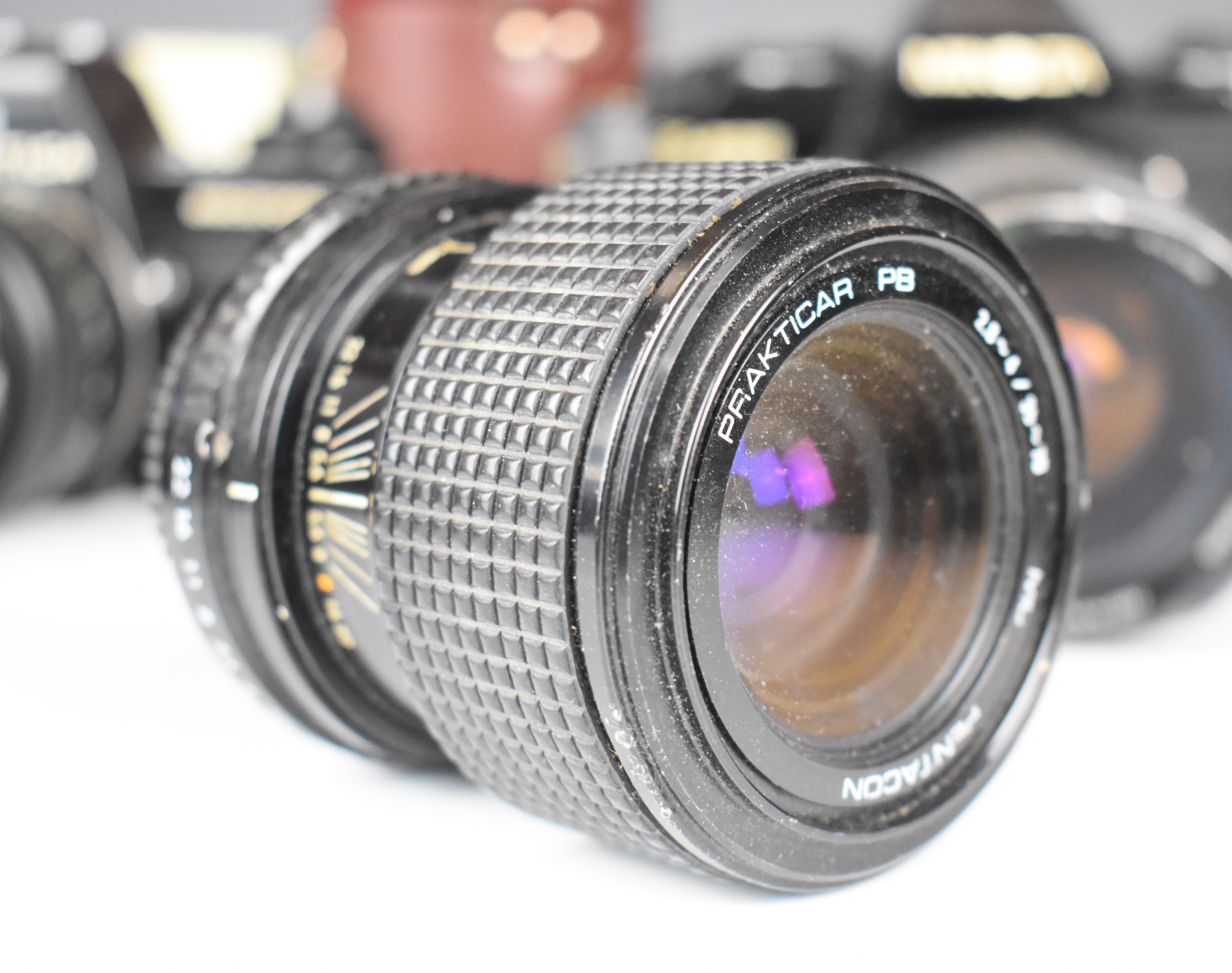 Three 35mm SLR cameras comprising Minolta X-500 with Minolta MD 50mm 1:1.7 and Super Paragon 28- - Image 6 of 11