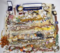 A collection of jewellery including silver bracelets, silver earrings, brooches, beads, collection