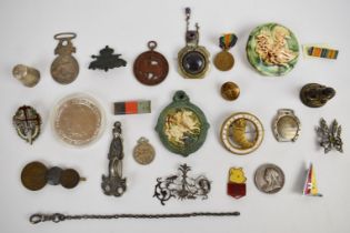 A collection of brooches/ medallions including hammered Arts & Crafts, enamelled 'sciencias letras e