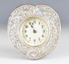 Art Nouveau hallmarked silver mounted desk or dressing table clock with embossed foliate decoration,