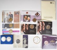 Ten coin packs including stamp covers and a cased pair of crowns, commemorating Elizabeth II
