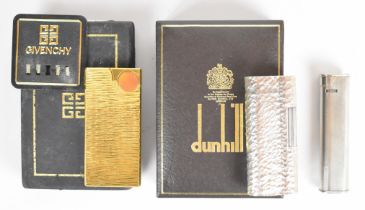 Two Dunhill cigarette lighters together with a Givenchy example. PLEASE NOTE WE ARE NOT ABLE TO