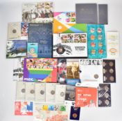 A collection of Royal Mint presentation packs of various 50p coins including Bletchley Park,