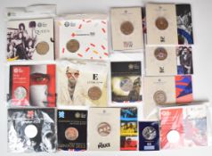 Fourteen largely Royal Mint brilliant uncirculated coin packs to include popular music, sporting,