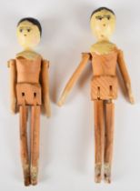 Two 19thC Grodnertal folk art style wooden peg dolls, length 17cm