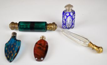Five 19thC scent / perfume bottles including double ended, overlaid and cut, fluted design with gilt