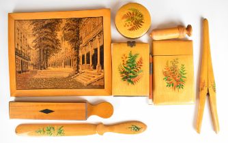 Satinwood treen items, most painted with flowers, comprising glove stretchers, page turner,