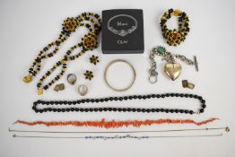 A suite of 1960's costume jewellery comprising earrings, necklace and bracelet, glass necklace