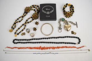 A suite of 1960's costume jewellery comprising earrings, necklace and bracelet, glass necklace