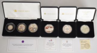 Four Jubilee Mint and other silver proof coins and coin sets comprising Elizabeth II Platinum