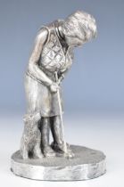 Modern novelty hallmarked silver model of a lady putting a golf ball with her dog beside her,