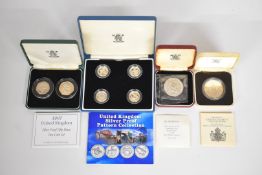 Four Royal Mint proof coin sets comprising United Kingdom Silver Pattern Collection set of four £1