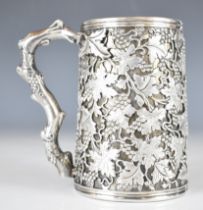 Likely Calcutta 19th century Indian colonial silver tankard with overlaid decoration of vines and