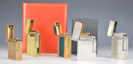 Six St Dupont and similar cigarette lighters, two in original presentation boxes. PLEASE NOTE WE ARE