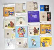 A collection of Royal Mint presentation packs of children's characters 50p coins including Gruffalo,