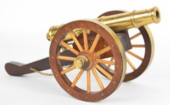 Brass and wood model of a 19th century cannon, length 29cm