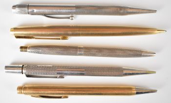 Five various hallmarked silver and gold plated propelling pencils and a ballpoint pen, including