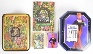 Two limited edition Zippo lighters comprising 1996 Pin Up and Mysteries of the Forest, both