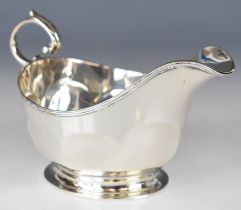 Art Deco hallmarked silver sauce boat with faceted body and scroll handle, Birmingham 1929, maker