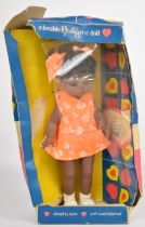 Pedigree Cleo Walker doll with black hair, brown weighted eyes, orange dress and matching