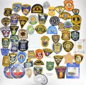 Large collection of approximately 300 American Police cloth badges including Parkland Police, County