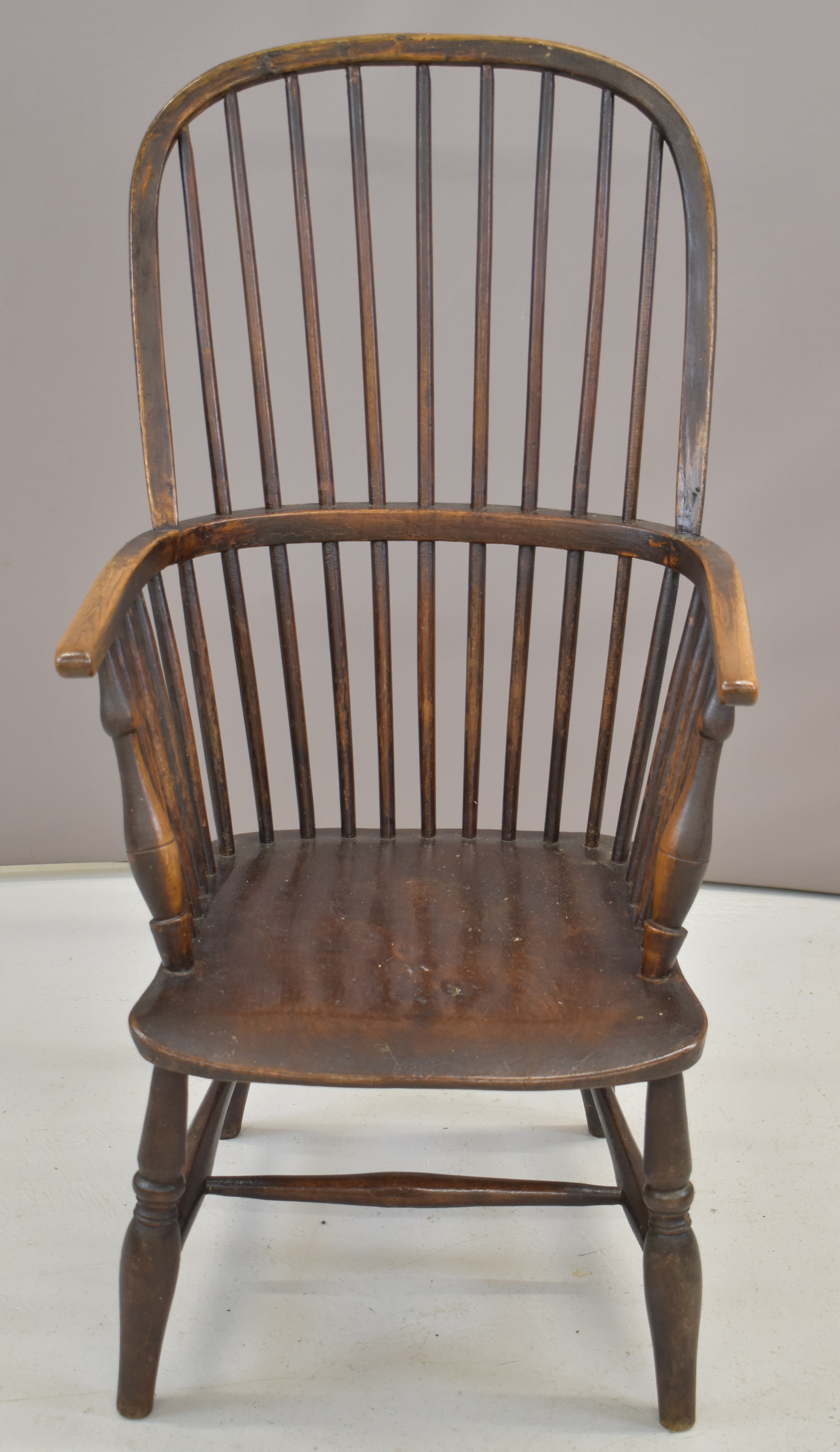 19thC elm seated Windsor armchair with hooped and spindle back