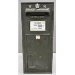 Victorian cast iron wall mounted letter box with VR cypher and crown to top, set with an enamel