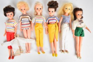 Six vintage Sindy dolls by Pedigree dressed in 1960's & 70's casual or sports clothing.