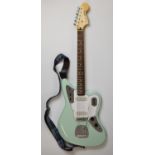 Squire Jaguar electric guitar by Fender in Surf Green finish with Duncan single coil pickups and