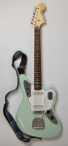 Squire Jaguar electric guitar by Fender in Surf Green finish with Duncan single coil pickups and