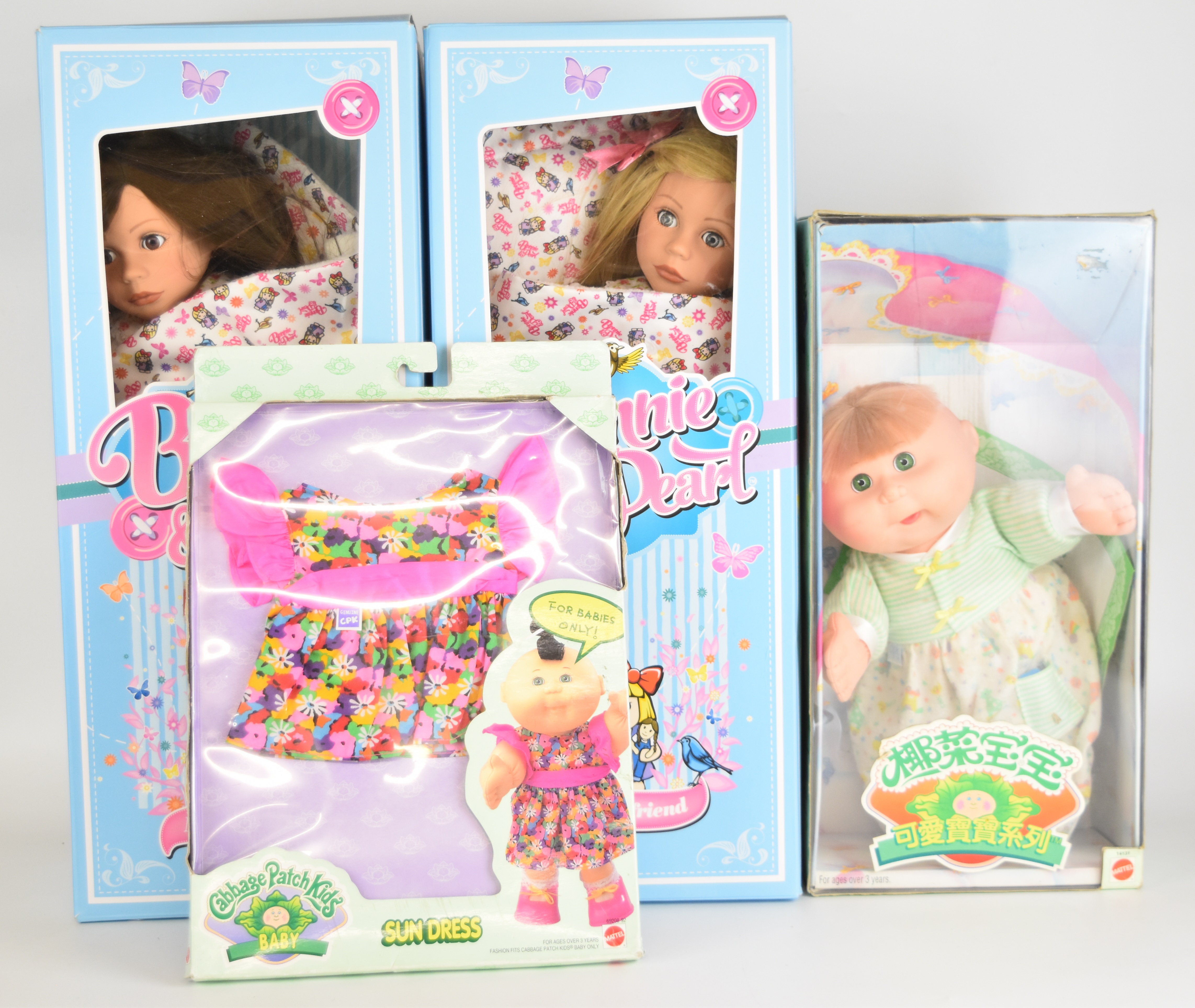 Three vinyl bodied dolls comprising two Bonnie and Pearl and one Cabbage Patch Kids, together with a