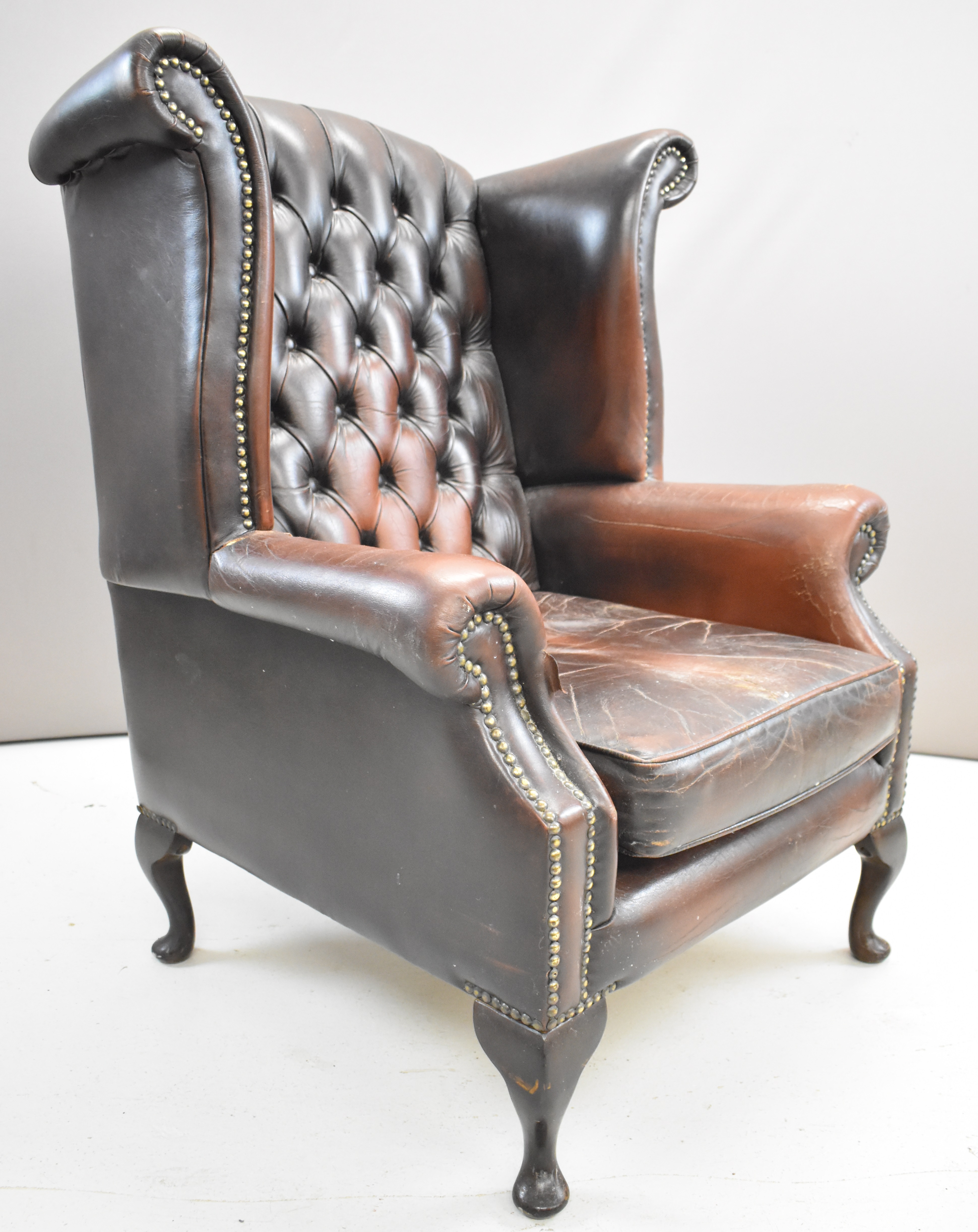 Brown leather Chesterfield wing back armchair raised on cabriole legs, height 105cm - Image 2 of 5