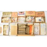 A world stamp collection in cigar boxes, including loose stamps and early mint and used world postal