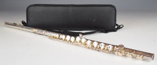 Virtuosi England three piece flute, length 67cm in fitted case