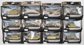 Twelve Unimax Forces of Valour 1:72 scale diecast model tanks to include U.S. M1A2 Abrams, M3A