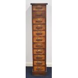 Oak collector's chest of eleven drawers with parquetry decoration, W30.5 x D40 x H147cm