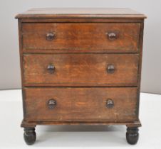 19thC oak bachelor's chest of three graduated drawers, raised on turned feet, W72 x D51 x H80cm